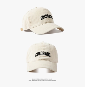 Detail view of cotton baseball cap showing Colorado embroidery and premium stitching