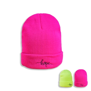 Detail showing high-quality fluorescent pink knit beanie with black hope embroidery