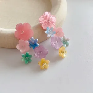 Colorful resin floral tassel earrings with translucent petals for a summer vacation look