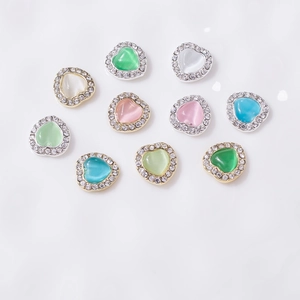 Cat eye heart nail charms set with rhinestones in mint pink blue and pearl white