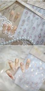 Macro view of M-115 embossed nail stickers with gold foil and vintage gem designs