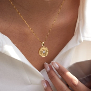 Classic 18K gold plated stainless steel sun pendant necklace with sparkling crystal inlay