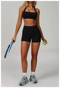 Detail of high-stretch halter sports bra and high-waist yoga shorts for women