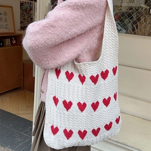 Knitted heart pattern tote bag with vintage red hearts on white thick yarn texture