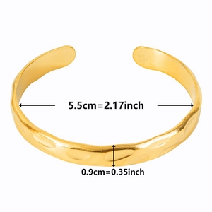 Detailed view of 18k gold plated stainless steel cuff with unique textured surface