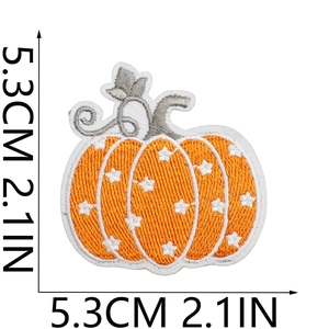 Close-up of 5.3cm pumpkin embroidery patch with white star pattern and dimensions