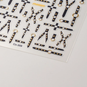 Close-up of 5D embossed nail sticker with black punk strap and gold rivet details