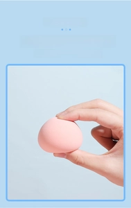 Macro shot of a pink soft makeup sponge showing high elasticity and soft texture