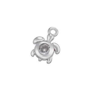 Detailed close-up of a silver sea turtle pendant with micro-pave zircon on white background