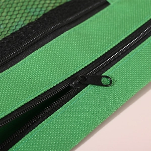 Green mesh pencil pouch with double zippers and three-hole binder design for storage