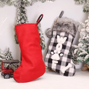 Classic plaid Christmas stocking with faux fur trim and WOOF embroidery for pet decor