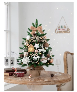 Detailed view of mini Christmas tree with burlap base, wood ornaments, and warm lights