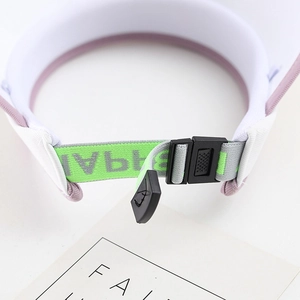 Detail of adjustable elastic strap and buckle on children summer straw sun visor hat
