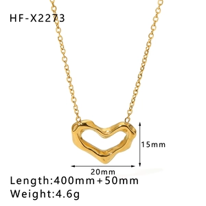 Macro view of gold plated hollow heart necklace pendant with detailed dimensions and specs