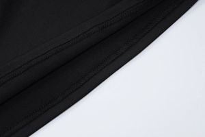 Detail of high-quality stitching and fine knit texture on black yoga sportswear