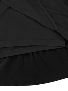 Close-up of double-stitched hem and pleated texture on a black tiered cake skirt
