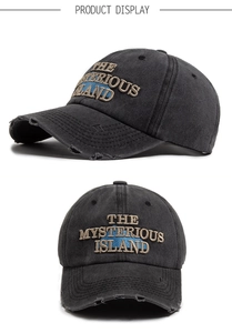 Close-up of distressed grey baseball cap with THE MYSTERIOUS ISLAND embroidery details
