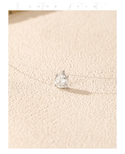 Close-up of D color moissanite pendant with four-prong setting on invisible fishing line