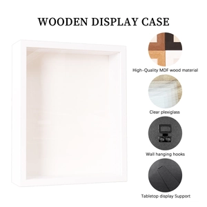 Detailed view of white shadow box frame with plexiglass and wall hanging hardware