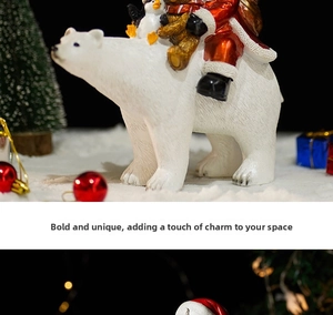 Detail of Christmas polar bear resin figurine with Santa bear and penguin on snow