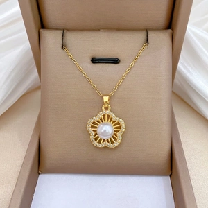 Elegant gold titanium steel five-petal flower pearl necklace set in a luxury jewelry box