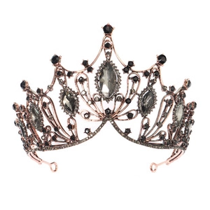 Detailed view of rose gold bridal tiara with dark grey gems and vintage hollow pattern