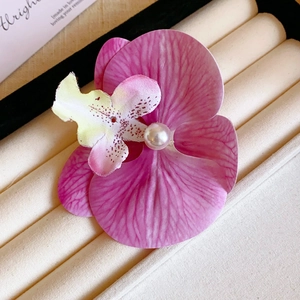 Pink gradient orchid flower hair clip with pearl detail for a refined vintage look