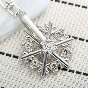 Rotating snowflake keychain with sparkling crystal rhinestones on a silver metal ring