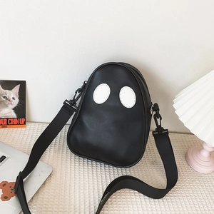 Detail of cute ghost-shaped PU leather crossbody bag with adjustable wide strap and eyes