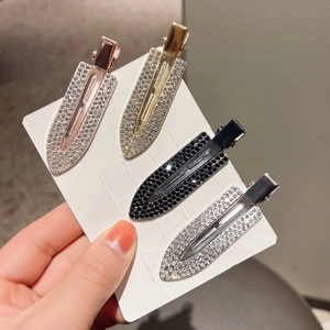 Set of four sparkling rhinestone hair clips in rose gold, gold, silver, and black finish