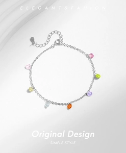 Macro view of S925 sterling silver chain featuring colorful round faceted gemstones