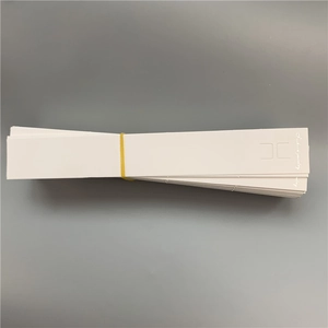 Stack of white rectangle paper cards for bracelets with rubber band and jewelry logo