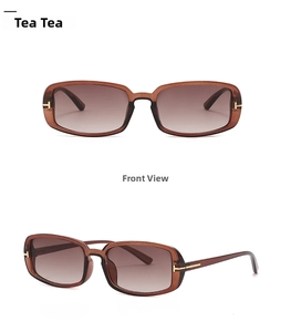 Detail of tea-colored rectangular sunglasses featuring golden T-shaped metal hinges
