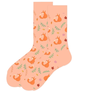 Detail of light orange crew socks with cartoon fox, leaf, and floral patterns