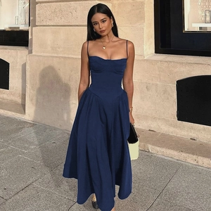 Detail of navy blue summer dress featuring a slim bodice and wide flared skirt