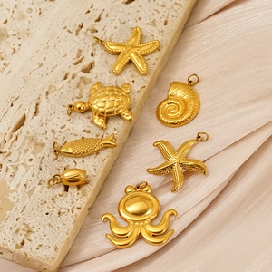 7-piece gold stainless steel sea life charms set including turtle and starfish pendants