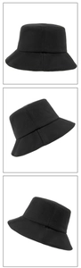 Three angles of a black cotton sun hat featuring a wide brim and minimalist design