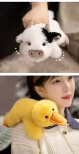 Detailed view of plush cow and duckling toys featuring fluffy texture and cute blushes