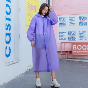 Translucent purple reusable raincoat for women featuring a hood and button closure