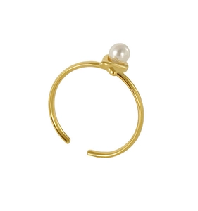 Detailed close-up of a minimalist golden ring with a white pearl and adjustable open band