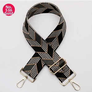 Close-up of adjustable woven shoulder strap No. 536 with gold swivel hooks and pattern