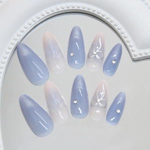 Morandi blue cat eye press-on nails with silver glitter bow and stiletto shape