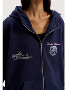Detail of navy blue oversized zip hoodie featuring Freedom Unlimited chest prints