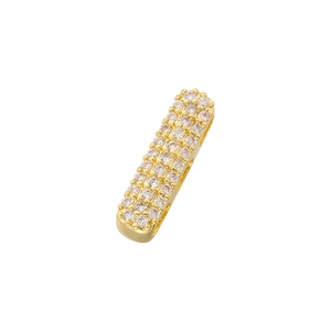 Macro detail of gold-plated rectangular pendant with pavé set cubic zirconia stones