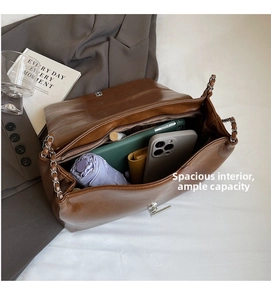 Interior view of brown PU tote showing large capacity for umbrella, phone, and tablet