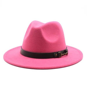 Detail of rose pink wool fedora hat featuring black leather band and bronze metal buckle