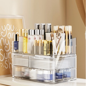 Clear acrylic makeup organizer with drawers and open compartments for skincare storage