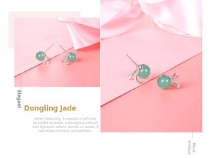 Macro detail of S925 sterling silver rabbit earrings featuring green aventurine jade stones