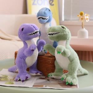 Three colorful plush T-Rex dinosaurs in purple, green, and blue on a cozy home table
