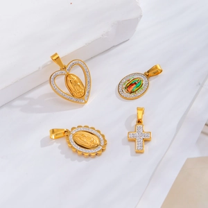 Golden religious pendant set with cross and heart charms on white stone base